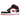 Jordan 1 Mid Gym Red Black White baskets en vue sous angle avec empeigne en cuir rouge, swoosh noir, détails blancs et lacets