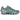 Nike Shox TL Cannon baskets en vue angulaire avec tige en mesh gris, colonnes Shox emblématiques dans la semelle et détails néon.