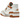 New Balance 550 Burnt Orange baskets en vue latérale avec détails en cuir orange, base blanche et semelle en gomme.