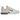 Nike Air Kukini Spiridon Cage 2 Stussy White baskets en vue angulaire avec tige en maille blanche, détails beiges et l'unité de talon amortissante caractéristique.