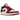 Air Jordan 1 Low Reverse Black Toe baskets en vue latérale avec cuir blanc, panneaux de talon rouges, swoosh noir et lacets blancs