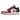 Air Jordan 1 Low Reverse Black Toe baskets en vue latérale avec base en cuir blanc, détails rouges au talon et swoosh noir iconique