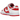 Nike Dunk Low Championship Red baskets vue latérale avec empeigne en cuir rouge et blanc, semelle intermédiaire blanche et semelle rouge emblématique.