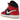 Air Jordan 1 Mid SE Christmas baskets vue sous angle avec détails rouge-vert, panneaux blancs et swoosh noir sur le côté