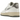 Nike Air Force 1 Low '07 Classics 50 Years Of Hip-Hop baskets en vue angulaire avec empeigne en cuir blanc, swoosh argenté et breloque micro.