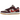 Nike SB Dunk Low Skate Like a Girl baskets en vue angulaire avec détails en daim bordeaux, empeigne crème et semelle en gomme