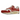 Nike Air Max 1 Red Stardust baskets en vue latérale avec empeigne en mesh blanc, empiècements en daim rouge et unité Air visible.