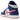 Air Jordan 1 Mid Knicks baskets vue sous un angle, présentant le design emblématique en cuir bleu et orange avec une semelle blanche et lacets.