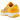 Nike Zoom Vomero 5 Yellow Ochre baskets vue de trois quarts avec tige jaune moutarde, semelle intermédiaire crème et détails gris