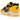 Nike Air Max 1 CO.JP Michigan Head to Head baskets vue latérale avec daim bleu marine, empeigne en cuir jaune et semelle blanche avec unité Air visible