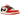 Air Jordan 1 Retro Low OG Trophy Room Rookie Card Away baskets vue inclinée avec empeigne en cuir blanc, détails rouges et logo Wings emblématique