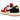 Air Jordan 1 Retro Low OG Trophy Room Rookie Card Away baskets en vue latérale avec des panneaux en cuir blanc, un Swoosh rouge et des détails dorés.