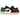 Baskets Air Jordan 1 Low Quai 54 vue sous un angle montrant le cuir blanc, les motifs géométriques détaillés et les panneaux multicolores au talon