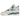 Air Jordan 4 Military Blue baskets en vue latérale, mettant en avant le cuir blanc, les détails bleus, l'avant-pied gris et le logo Jumpman au talon.