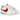 Baskets Nike Classic Cortez Forrest Gump vue latérale avec empeigne en cuir blanc, Swoosh rouge emblématique et semelle intercalaire rayée classique