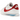 Nike Classic Cortez Forrest Gump baskets en vue latérale avec empeigne en cuir blanc, Swoosh rouge et semelle intermédiaire rayée bleue et rouge