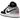 Air Jordan 1 Low SE Panda Toe baskets vue latérale avec base en cuir blanc, empiècements noirs sur la pointe et logo Jumpman blanc sur la languette