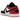 Air Jordan 1 Low SE Black Toe (2025) baskets vue latérale mettant en valeur le design emblématique en cuir blanc et noir avec un talon rouge.