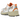 New Balance 530 White Sun Glow baskets en vue inclinée avec tige blanche, détails jaunes et semelle blanche amortissante