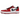 Jordan 1 Low Golf Spiked Varsity Red White Black baskets vue sous angle avec une empeigne en cuir rouge et blanc et des lacets noirs