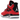 Jordan 4 Retro Toro Bravo baskets en profil latéral avec une tige en nubuck rouge, des détails noirs et une unité Air visible